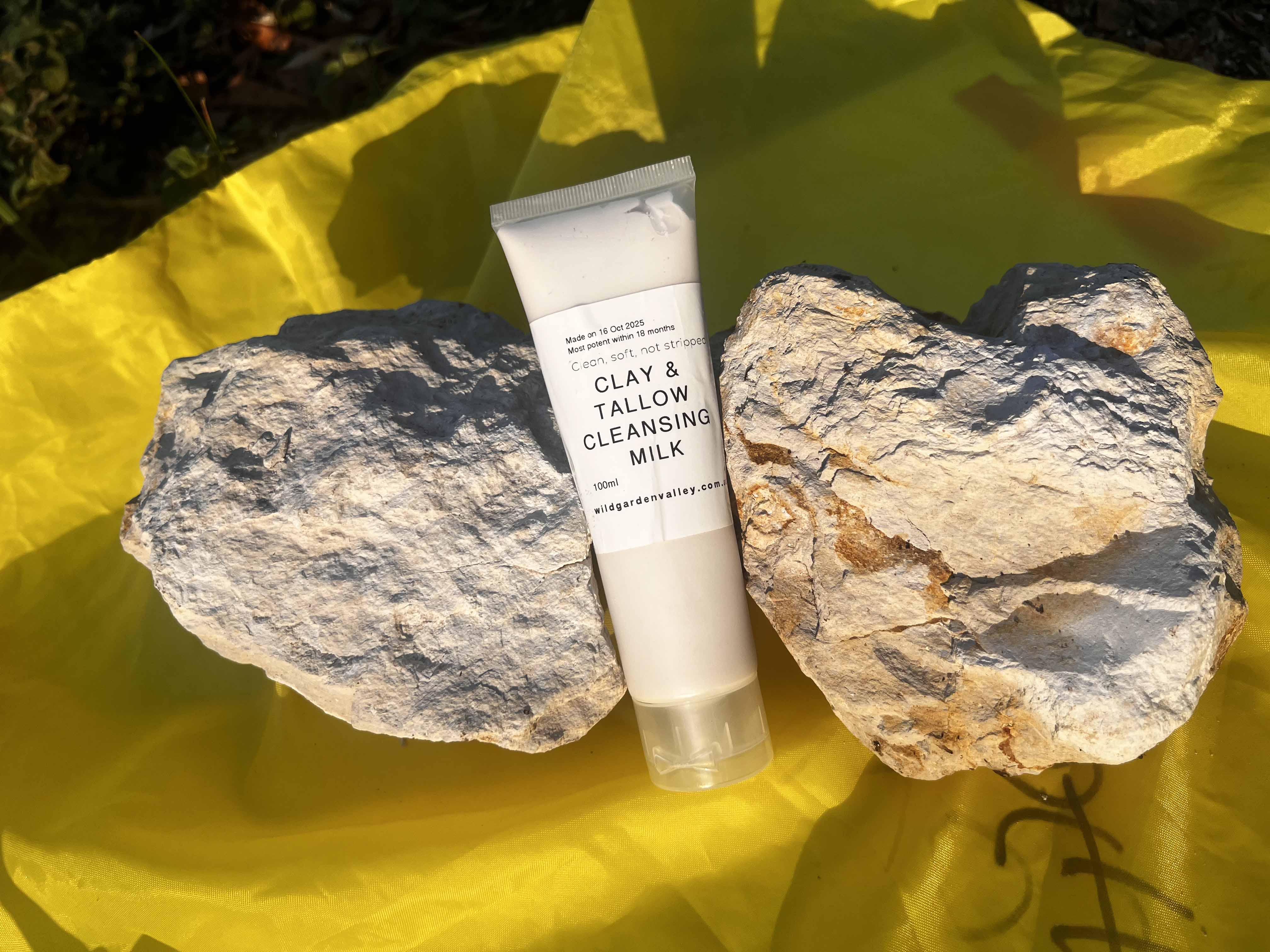 face cleanser squeezed from bottle onto hand.